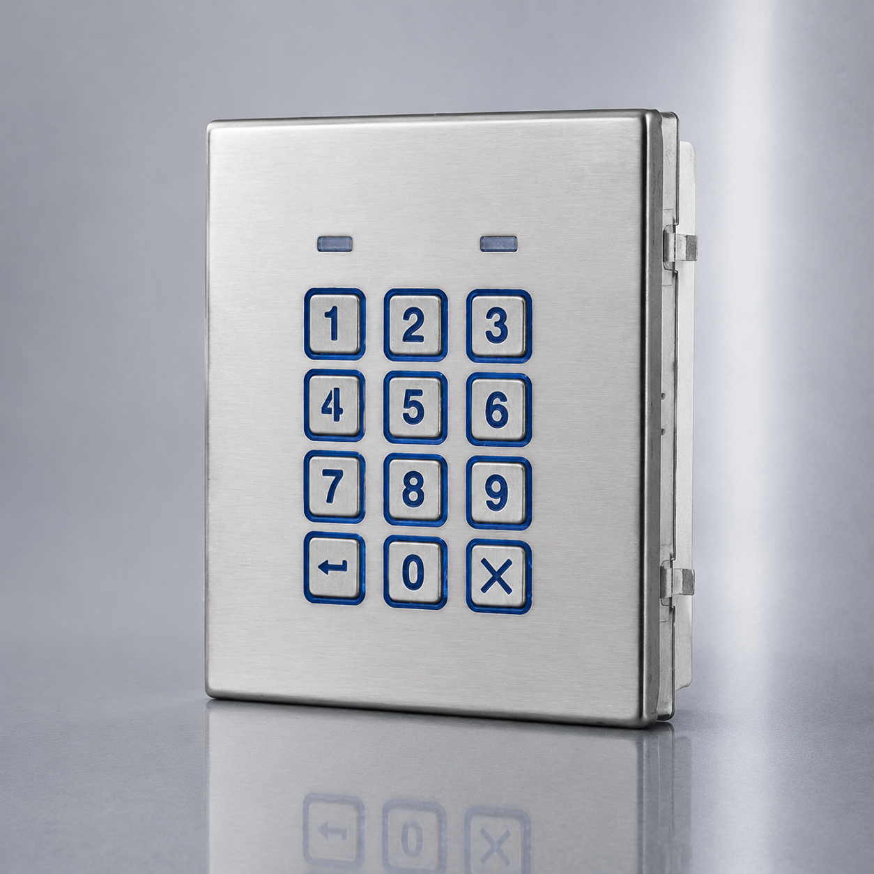 A brushed stainless steel keypad panel with blue-outlined numeric buttons 0-9, a backspace symbol, and a multiplication symbol, shown on a reflective gray surface. videx