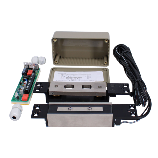 An industrial electronic control module kit with a beige junction box, a black metal mounting bracket, a silver metal sensor block, a black cable, a small green circuit board, and white connector fittings, all shown on a white background. Adams Rite 1354-0100