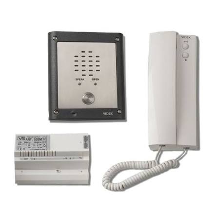A Voig intercom system on a white background, showing a white wall-mounted receiver with coiled cord, a small white wall plate, and a black rectangular speaker box with a silver front panel.